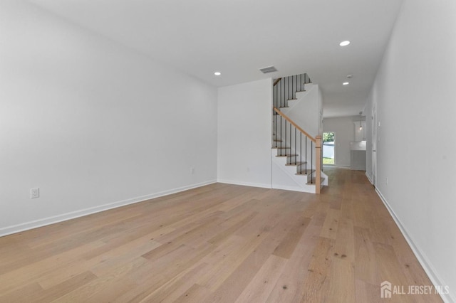 243 E 9th Ave, Roselle, NJ 07203 - empty room featuring stairs, light wood-style flooring, and recessed lighting