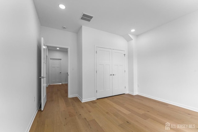 243 E 9th Ave, Roselle, NJ 07203 - unfurnished bedroom featuring light wood-type flooring, recessed lighting, and a closet