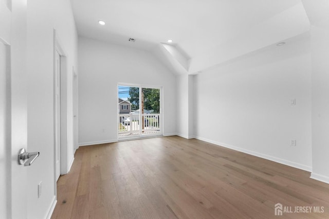 243 E 9th Ave, Roselle, NJ 07203 - empty room with wood finished floors, vaulted ceiling, and recessed lighting
