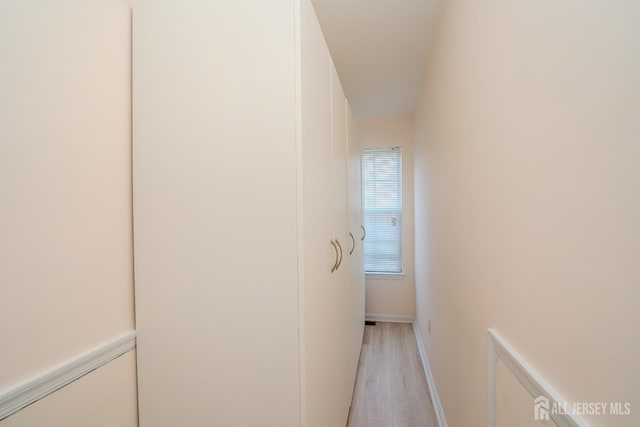 908 Blossom Cir S, Brunswick, NJ 08810 - hallway featuring light wood-style floors and baseboards