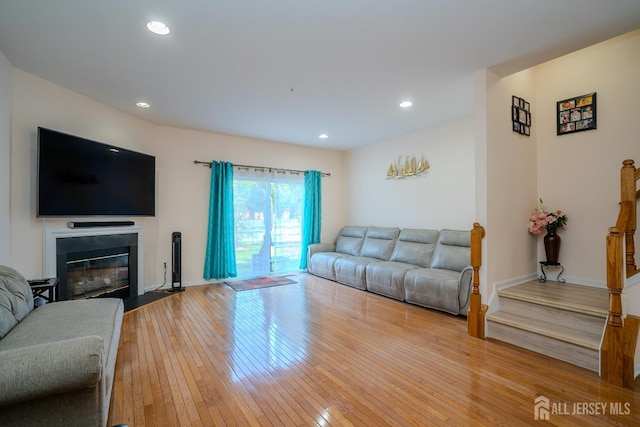 908 Blossom Cir S, Brunswick, NJ 08810 - living area featuring hardwood / wood-style floors, a fireplace with flush hearth, and recessed lighting