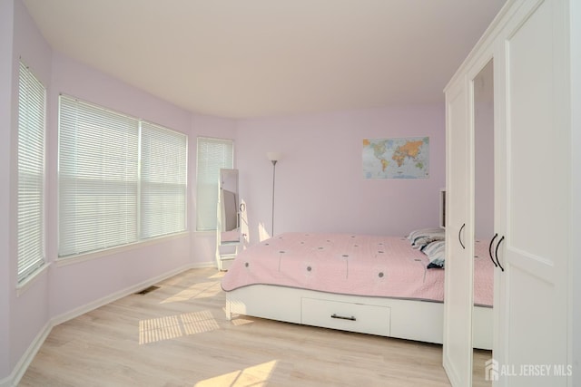 908 Blossom Cir S, Brunswick, NJ 08810 - bedroom featuring light wood finished floors and baseboards