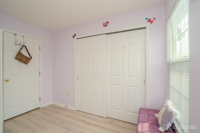 908 Blossom Cir S, Brunswick, NJ 08810 - unfurnished bedroom featuring light wood-style floors and a closet