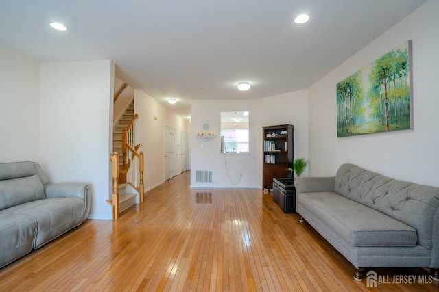 908 Blossom Cir S, Brunswick, NJ 08810 - living room featuring stairway, light wood finished floors, and recessed lighting
