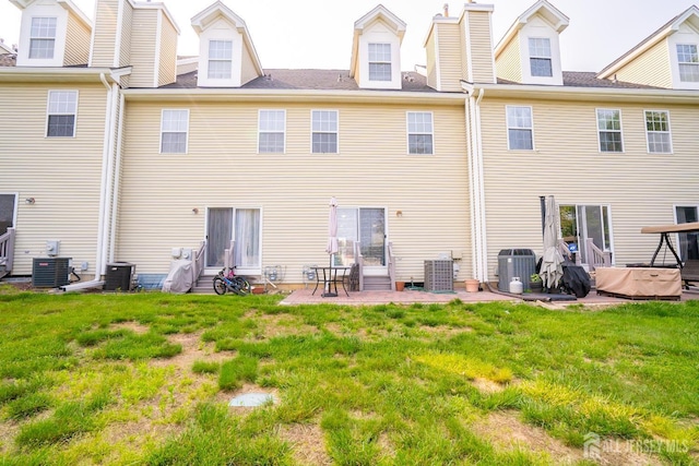 908 Blossom Cir S, Brunswick, NJ 08810 - rear view of house featuring entry steps, a yard, and a patio area