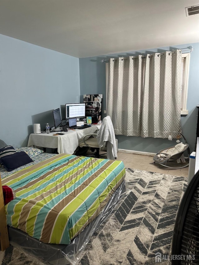 bedroom featuring tile patterned floors