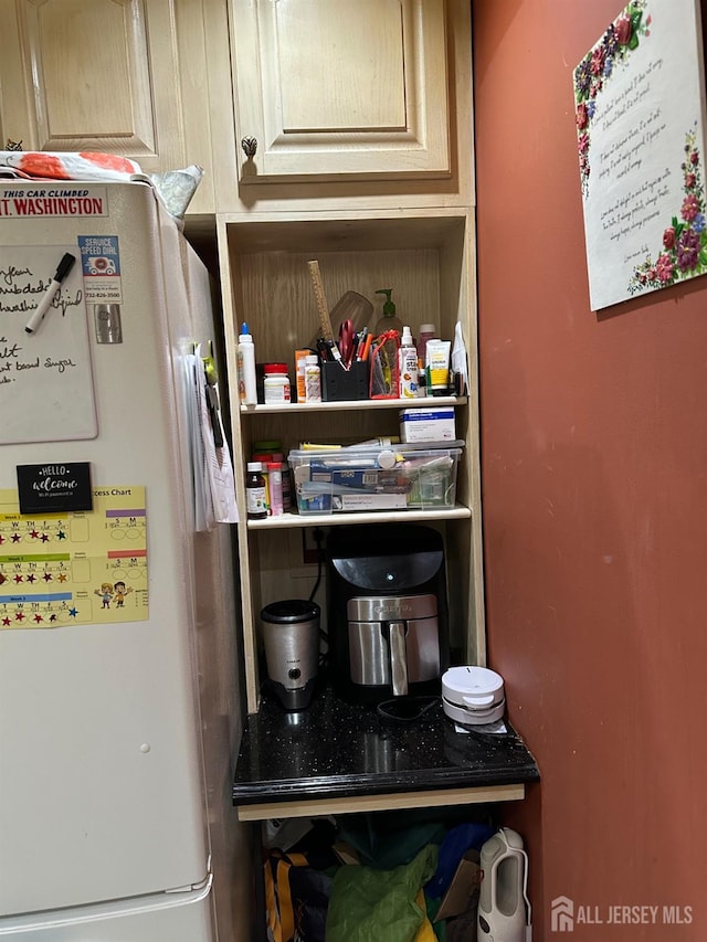 pantry with light brown cabinetry