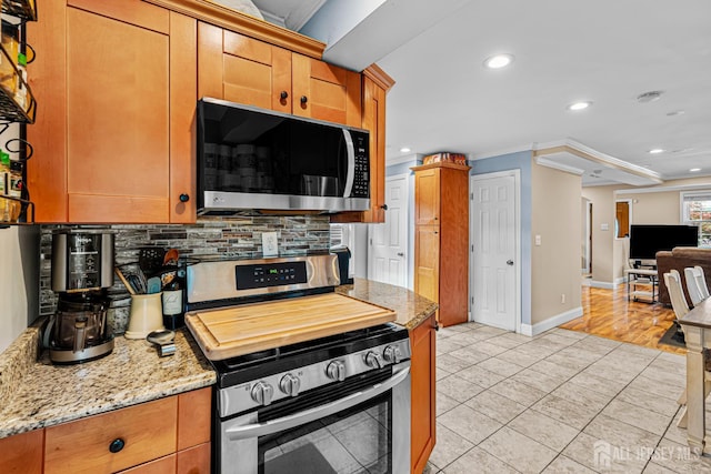 249 Garfield Ave, Old Bridge, NJ 08879 - kitchen featuring appliances with stainless steel finishes, decorative backsplash, recessed lighting, ornamental molding, and light tile patterned floors