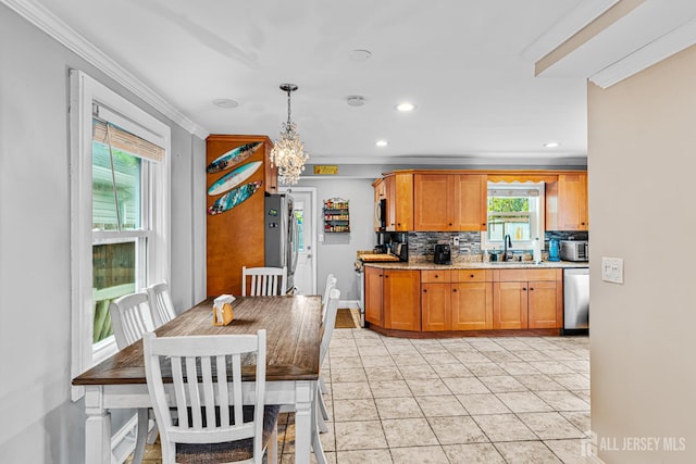249 Garfield Ave, Old Bridge, NJ 08879 - kitchen featuring appliances with stainless steel finishes, crown molding, tasteful backsplash, a sink, and a chandelier