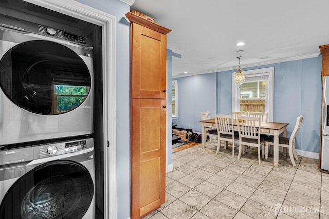 249 Garfield Ave, Old Bridge, NJ 08879 - laundry room with stacked washer / dryer, crown molding, recessed lighting, light tile patterned flooring, and baseboards