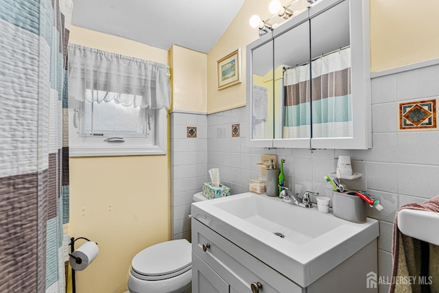 249 Garfield Ave, Old Bridge, NJ 08879 - bathroom featuring tile walls, vanity, and toilet