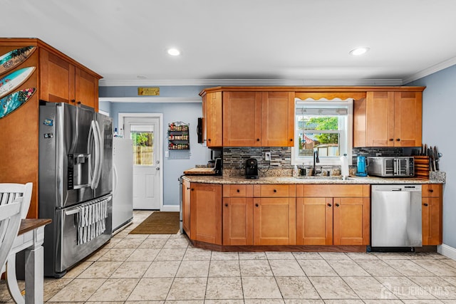 249 Garfield Ave, Old Bridge, NJ 08879 - kitchen featuring appliances with stainless steel finishes, a sink, tasteful backsplash, plenty of natural light, and crown molding