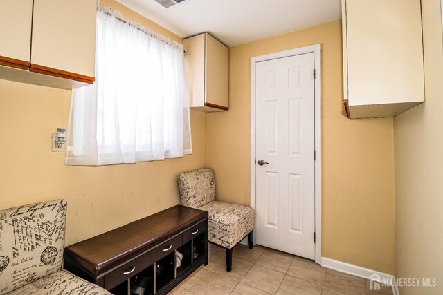 living area featuring light tile patterned floors