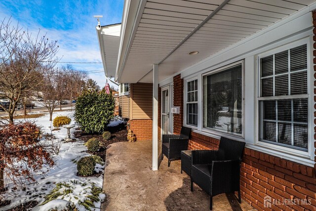 view of snow covered patio