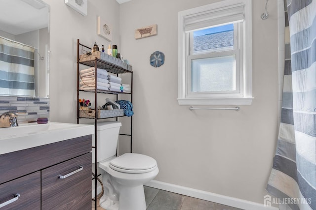 318 Bayview Ave, Union Beach, NJ 07735 - bathroom with tile patterned floors, baseboards, decorative backsplash, vanity, and toilet