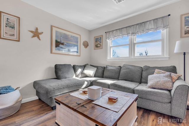 318 Bayview Ave, Union Beach, NJ 07735 - living room with dark wood-style flooring and baseboards