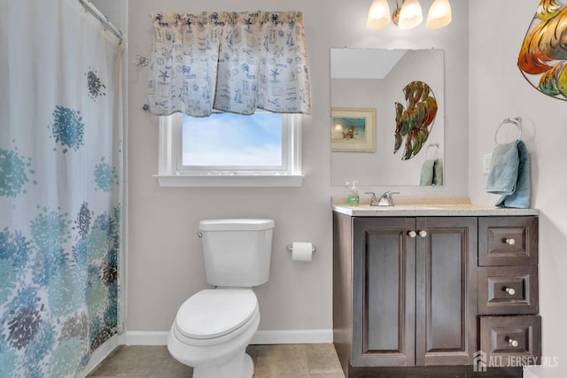 318 Bayview Ave, Union Beach, NJ 07735 - bathroom featuring baseboards, toilet, vanity, tile patterned floors, and a shower with shower curtain