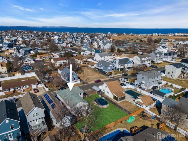 318 Bayview Ave, Union Beach, NJ 07735 - aerial view of residential area featuring a pool area and a large body of water