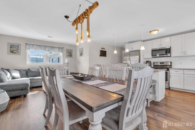 318 Bayview Ave, Union Beach, NJ 07735 - dining area with wood finished floors