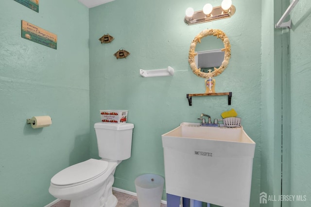 318 Bayview Ave, Union Beach, NJ 07735 - bathroom with a sink, toilet, and baseboards
