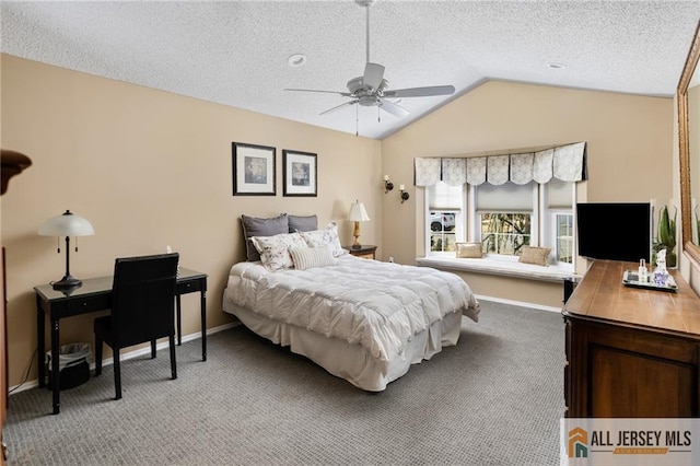 bedroom featuring a textured ceiling, baseboards, light colored carpet, ceiling fan, and vaulted ceiling