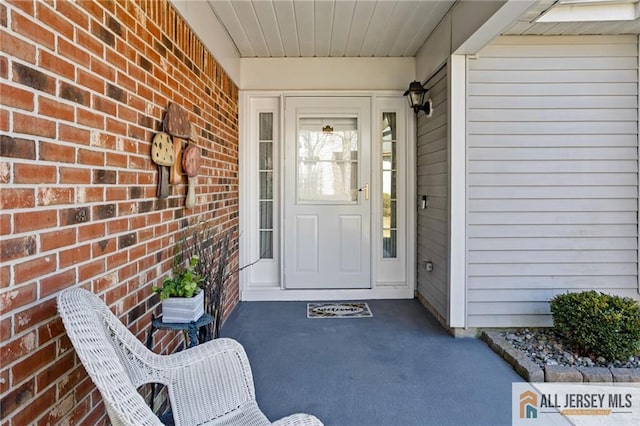 property entrance with brick siding