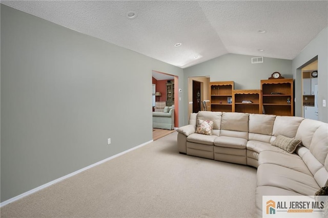 living room with visible vents, baseboards, light colored carpet, lofted ceiling, and a textured ceiling