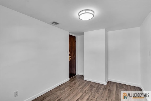 20 Cedar Ave, North Brunswick, NJ 08902 - empty room with wood finished floors and baseboards