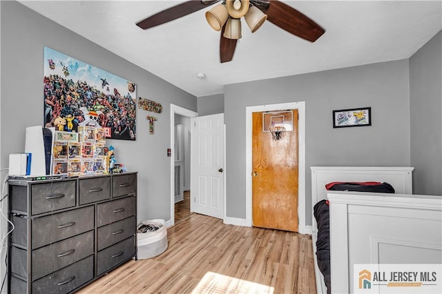 20 Cedar Ave, North Brunswick, NJ 08902 - bedroom with light wood-style flooring, ceiling fan, and baseboards