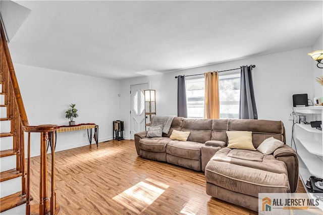 20 Cedar Ave, North Brunswick, NJ 08902 - living area with light wood-style flooring and stairway