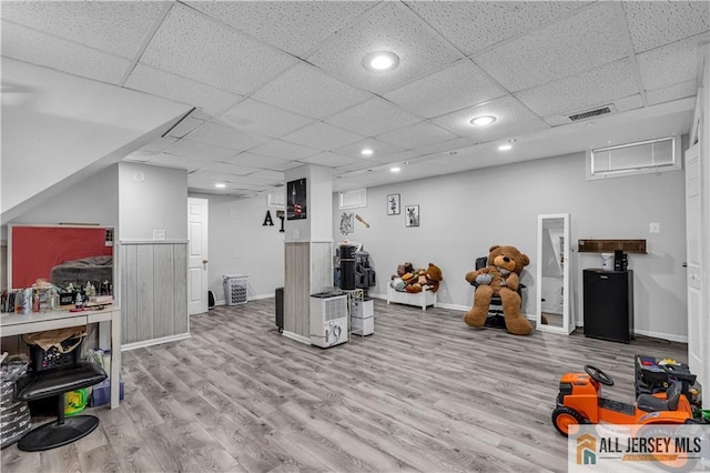 20 Cedar Ave, North Brunswick, NJ 08902 - exercise area featuring wood finished floors, baseboards, recessed lighting, and a paneled ceiling
