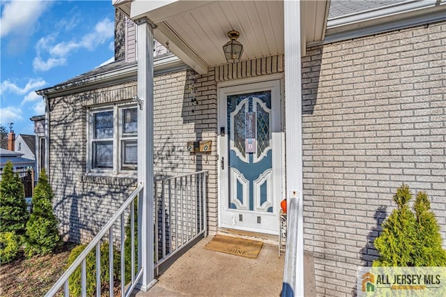 20 Cedar Ave, North Brunswick, NJ 08902 - doorway to property featuring brick siding