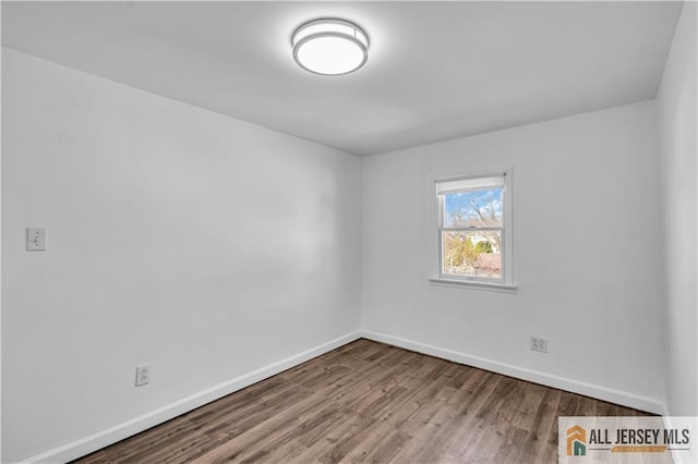 20 Cedar Ave, North Brunswick, NJ 08902 - empty room with baseboards and wood finished floors