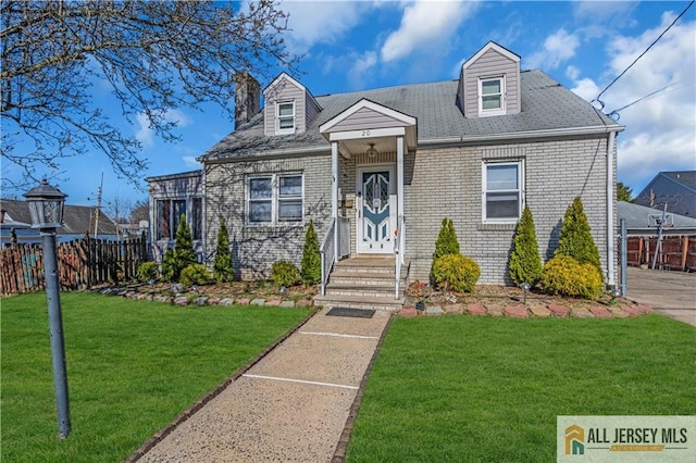 20 Cedar Ave, North Brunswick, NJ 08902 - cape cod house featuring brick siding and a chimney