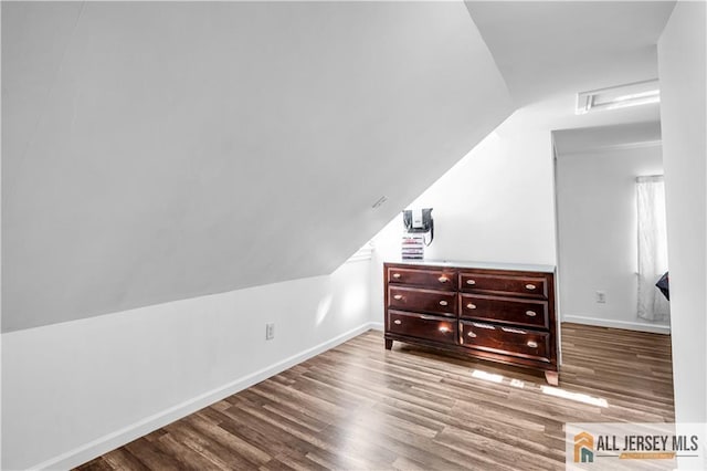 20 Cedar Ave, North Brunswick, NJ 08902 - additional living space with wood finished floors, vaulted ceiling, and baseboards