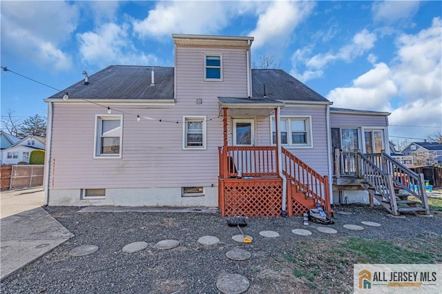 20 Cedar Ave, North Brunswick, NJ 08902 - back of property with fence and roof with shingles