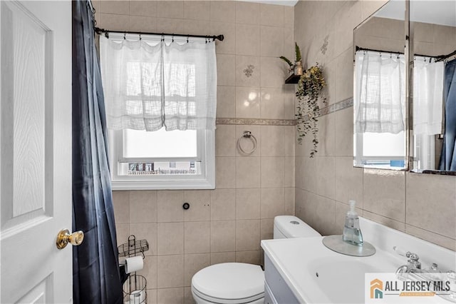 20 Cedar Ave, North Brunswick, NJ 08902 - full bathroom with tile walls, toilet, plenty of natural light, and vanity