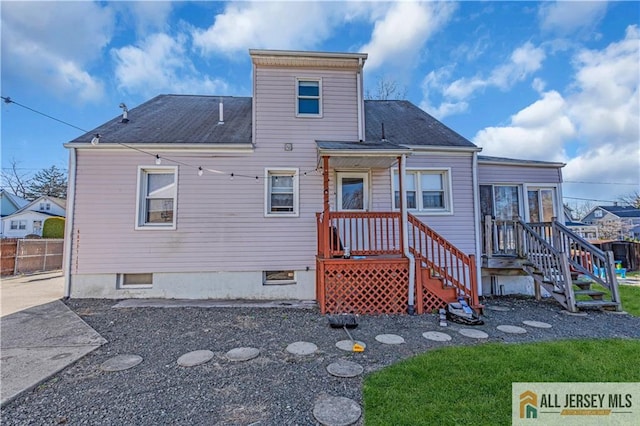 20 Cedar Ave, North Brunswick, NJ 08902 - back of house featuring fence and a shingled roof