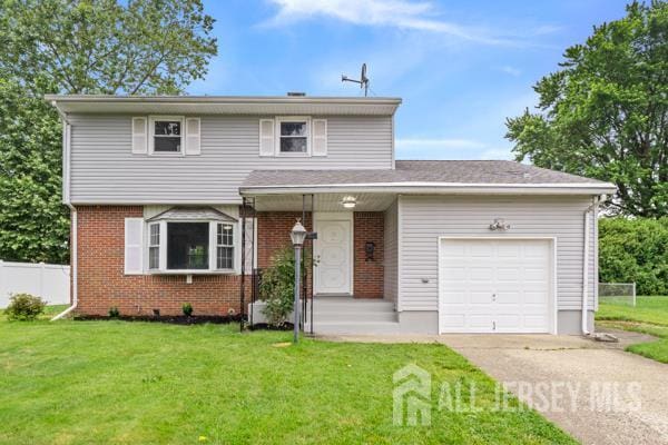 2164 Whitehorse Hamilton Square Rd, Hamilton, NJ 08690 - view of front of house featuring an attached garage, driveway, and brick siding