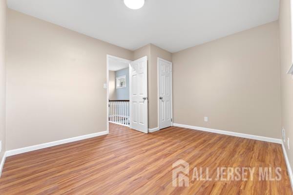 2164 Whitehorse Hamilton Square Rd, Hamilton, NJ 08690 - unfurnished bedroom featuring baseboards and light wood finished floors