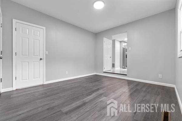 2164 Whitehorse Hamilton Square Rd, Hamilton, NJ 08690 - unfurnished room with baseboards and dark wood-style flooring