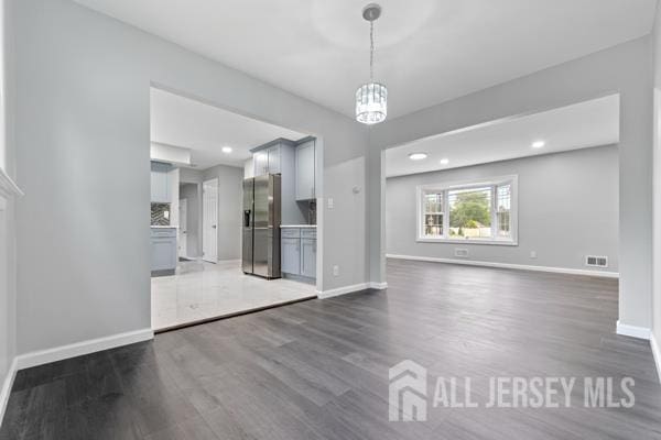 2164 Whitehorse Hamilton Square Rd, Hamilton, NJ 08690 - unfurnished living room with dark wood-type flooring, a chandelier, and recessed lighting
