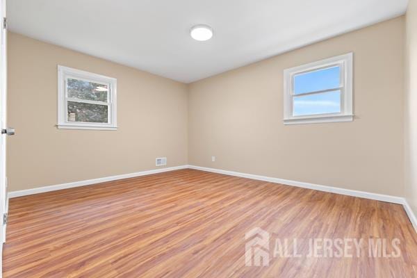 2164 Whitehorse Hamilton Square Rd, Hamilton, NJ 08690 - spare room with healthy amount of natural light and light wood finished floors