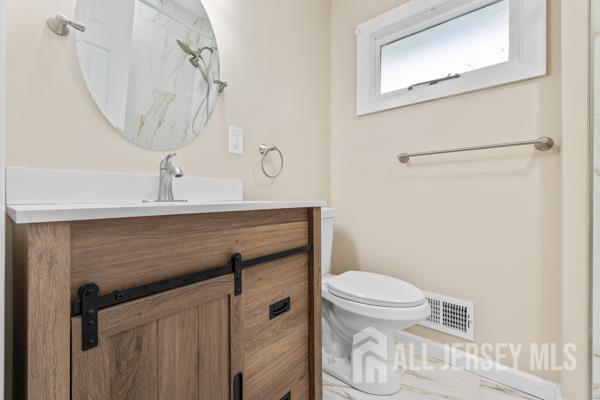 2164 Whitehorse Hamilton Square Rd, Hamilton, NJ 08690 - bathroom featuring vanity and toilet