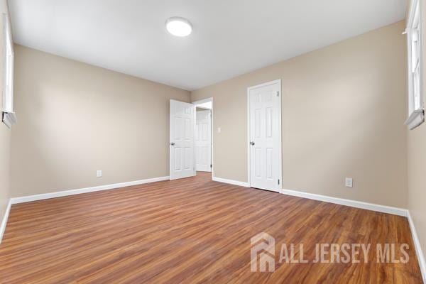 2164 Whitehorse Hamilton Square Rd, Hamilton, NJ 08690 - unfurnished bedroom with wood finished floors and baseboards