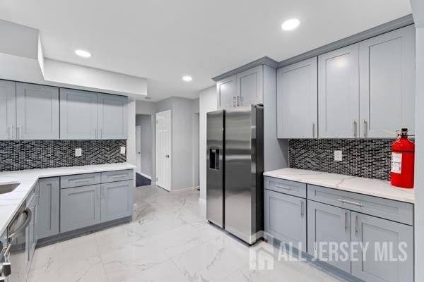 2164 Whitehorse Hamilton Square Rd, Hamilton, NJ 08690 - kitchen featuring appliances with stainless steel finishes, gray cabinets, backsplash, recessed lighting, and light marble finish floors