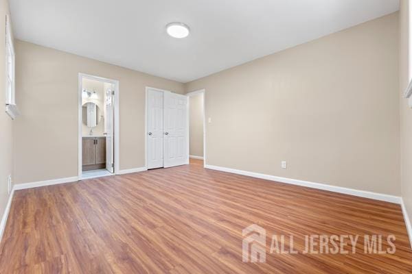 2164 Whitehorse Hamilton Square Rd, Hamilton, NJ 08690 - unfurnished bedroom featuring wood finished floors and ensuite bathroom