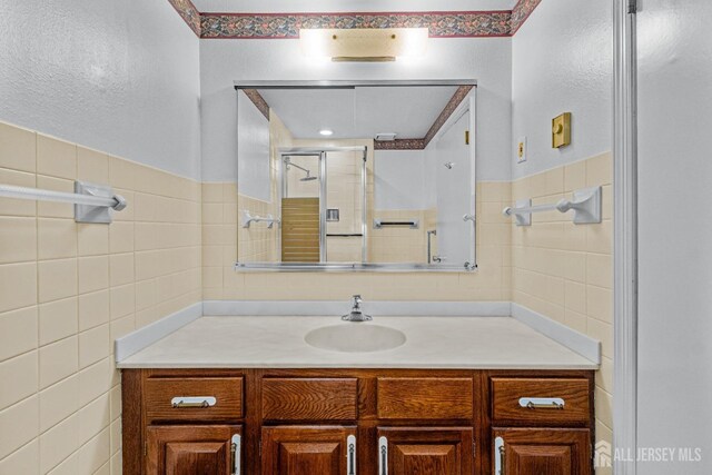 553-N Tilton Way, Monroe, NJ 08831 - full bathroom featuring tile walls, vanity, and a stall shower