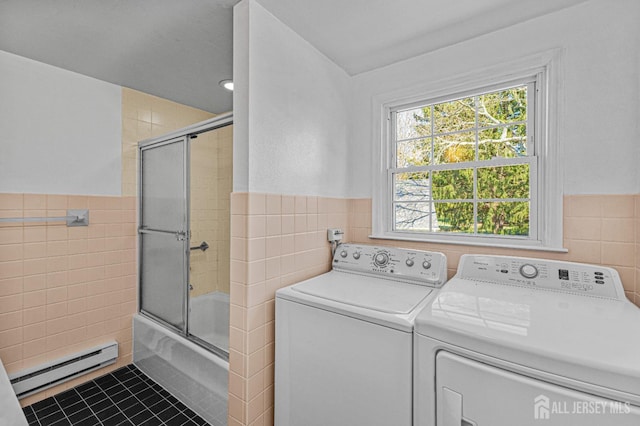 553-N Tilton Way, Monroe, NJ 08831 - laundry room featuring tile walls, washer and dryer, a baseboard radiator, wainscoting, and tile patterned flooring