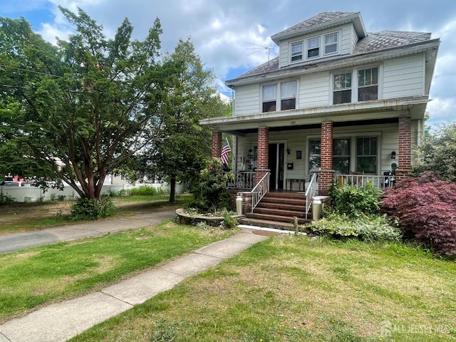 100 Jackson St, South River, NJ 08882 - traditional style home featuring a porch and a front lawn